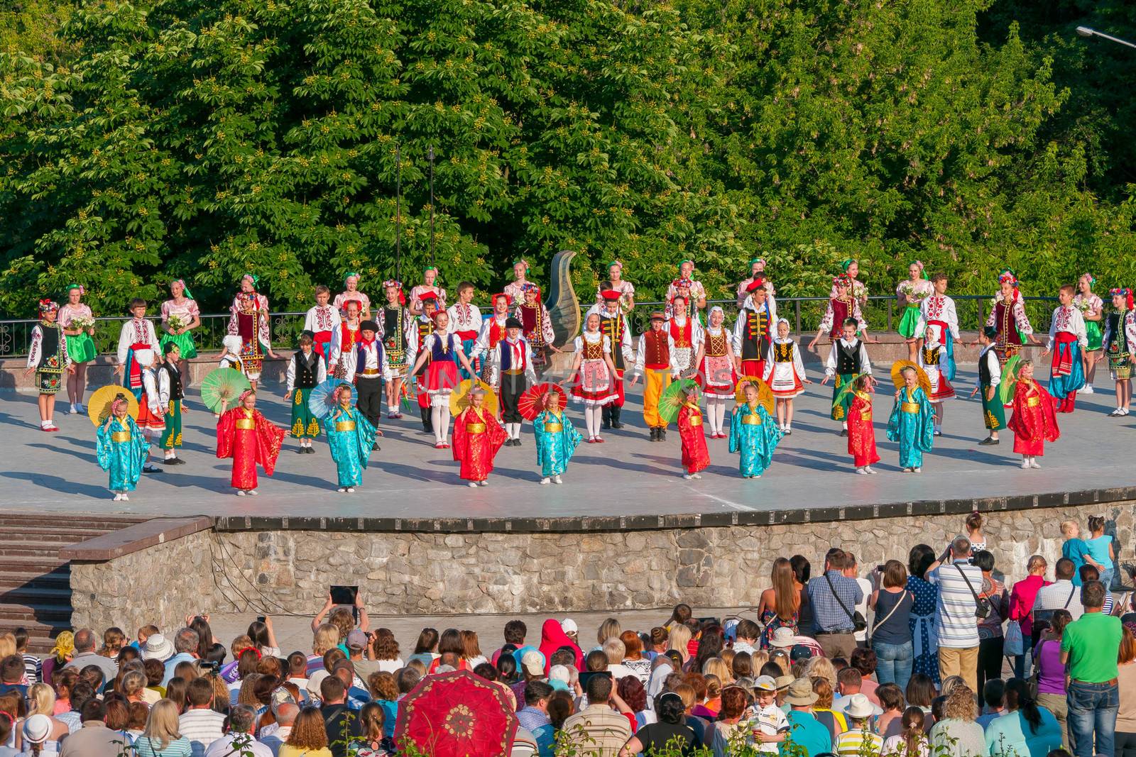 KIEV, UKRAINE - July 22 , 2016: Ukraina School of Dance Ensemble girls and boys dressed in traditional red Ukrainian embroidered costume clothes dancing