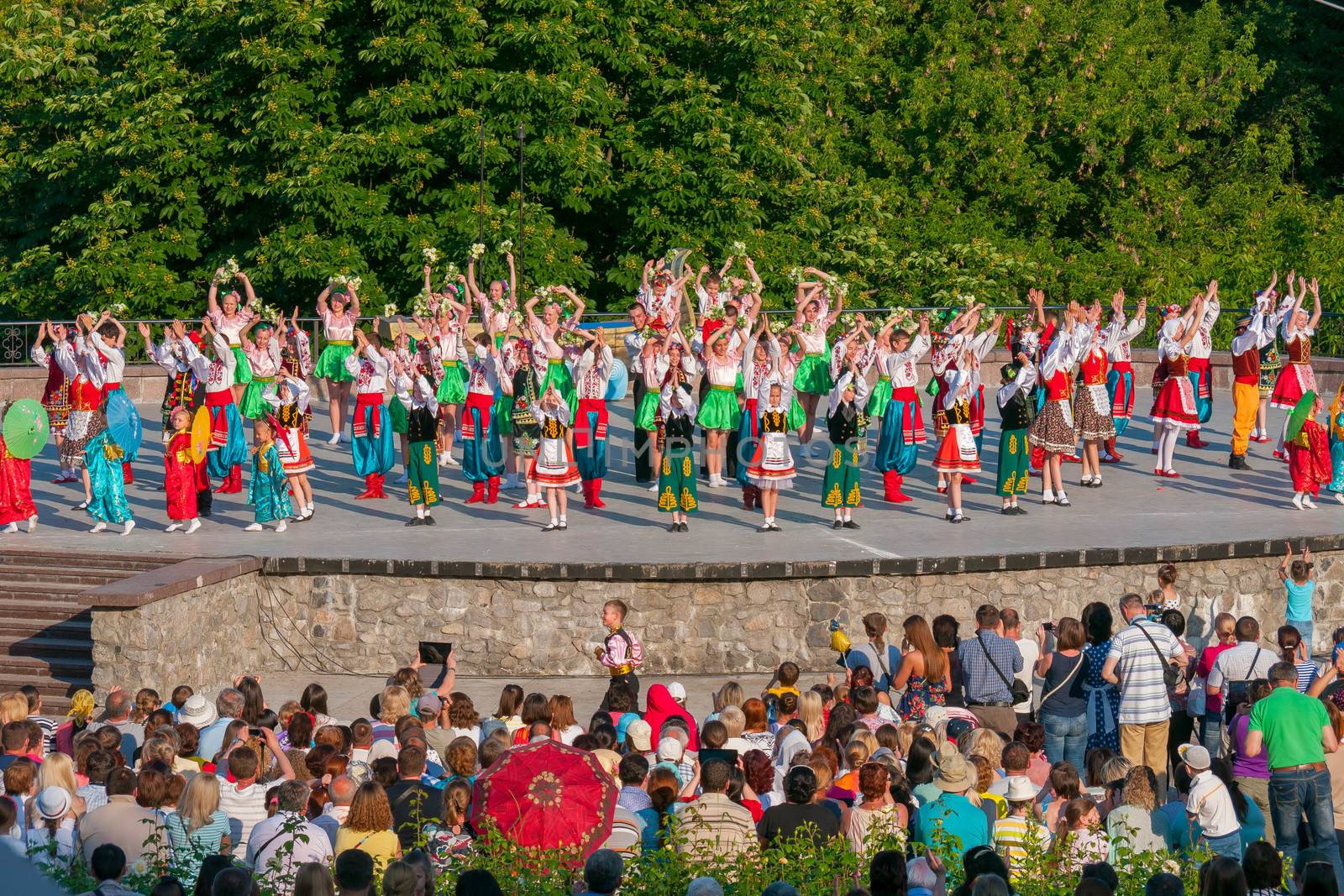 KIEV, UKRAINE - July 22 , 2016: Ukraina School of Dance Ensemble girls and boys dressed in traditional red Ukrainian embroidered costume clothes dancing