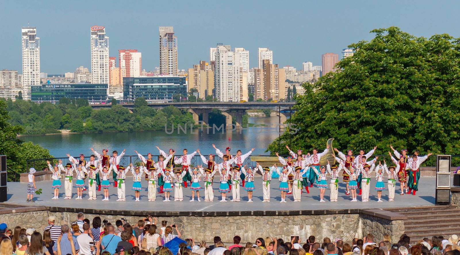 KIEV, UKRAINE - July 22 , 2016: Ukraina School of Dance Ensemble girls and boys dressed in traditional red Ukrainian embroidered costume clothes dancing