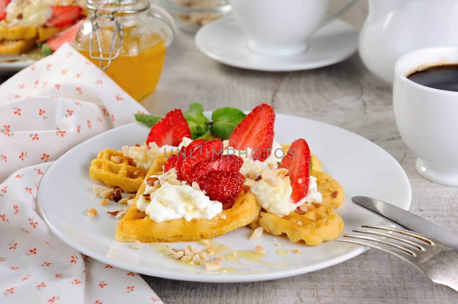  Delicate, melting  mouth-watering  Belgian waffles with whipped cream, strawberries, flavored with peanuts and honey. What could be better for breakfast.