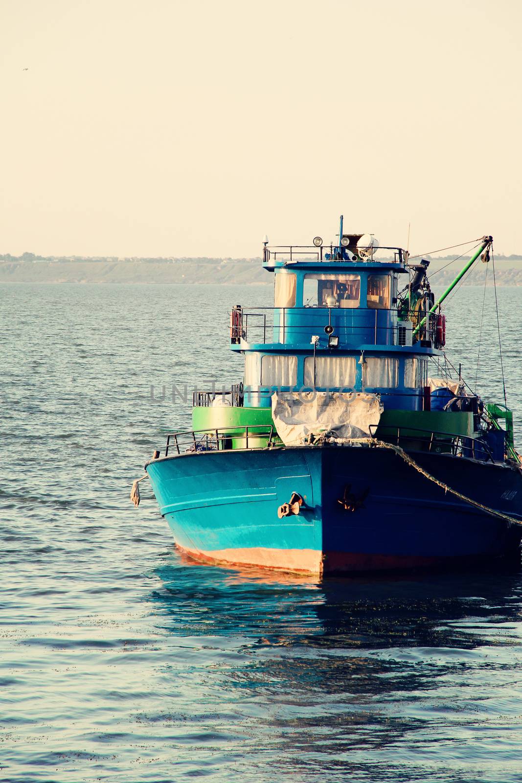 Large fish processing boat in the deep water dock on a sunny summer day. photo