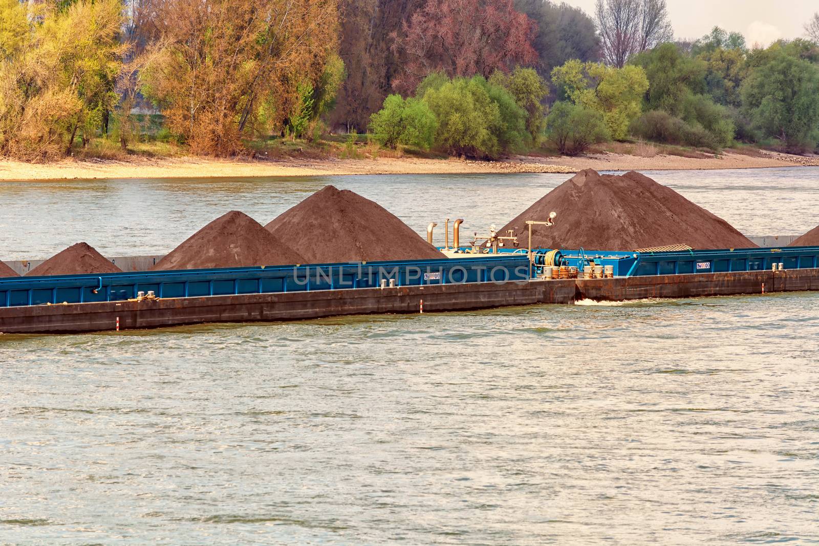 Ship on the Rhine near Dusseldorf, Germany. In the background the opposite shore.
