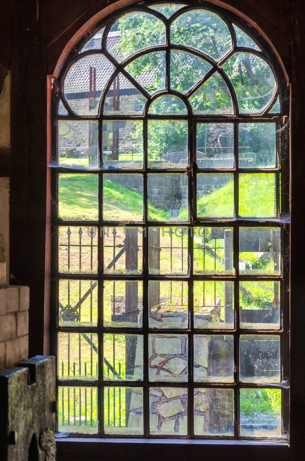 Historic old cast-windows in an old abandoned factory