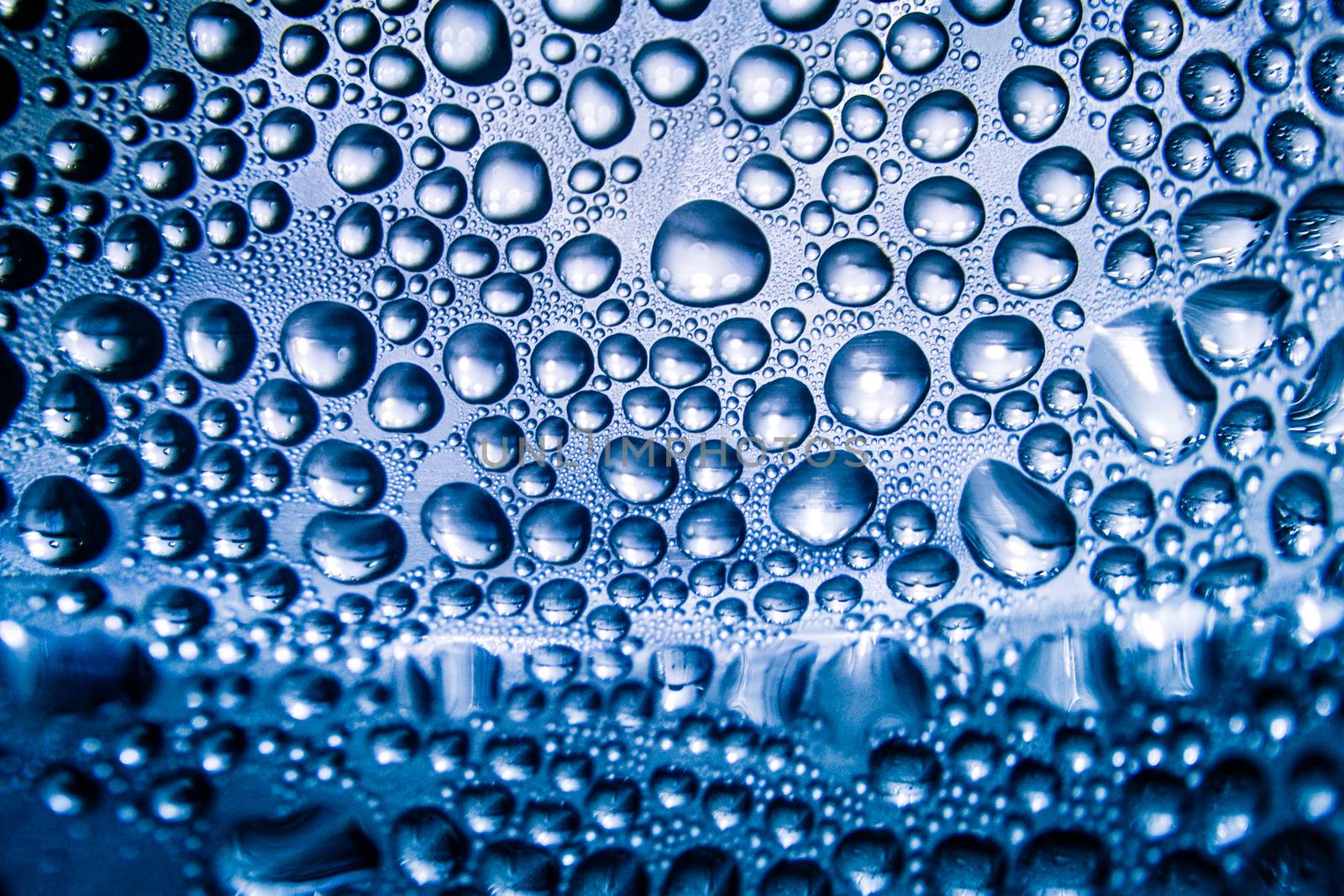 Texture of water drops on bottle by apichart