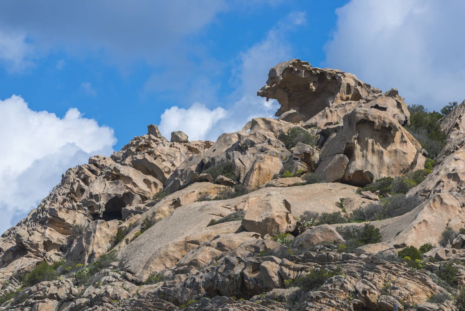 nature background with rocks and blue sky on sardinia by compuinfoto