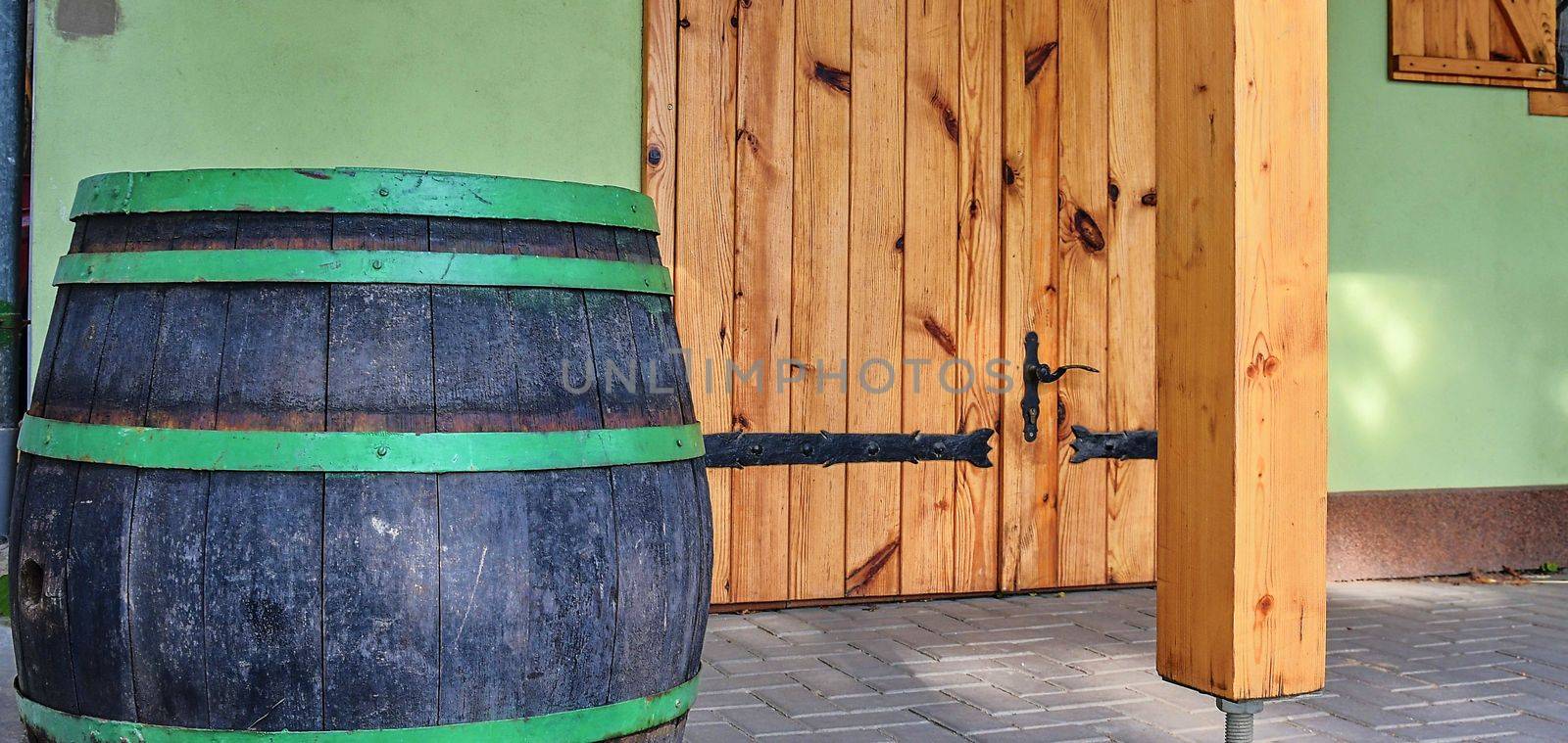 Old rustic wine barrel. Wine background in Europe. Czech Republic, South Moravia by roman_nerud