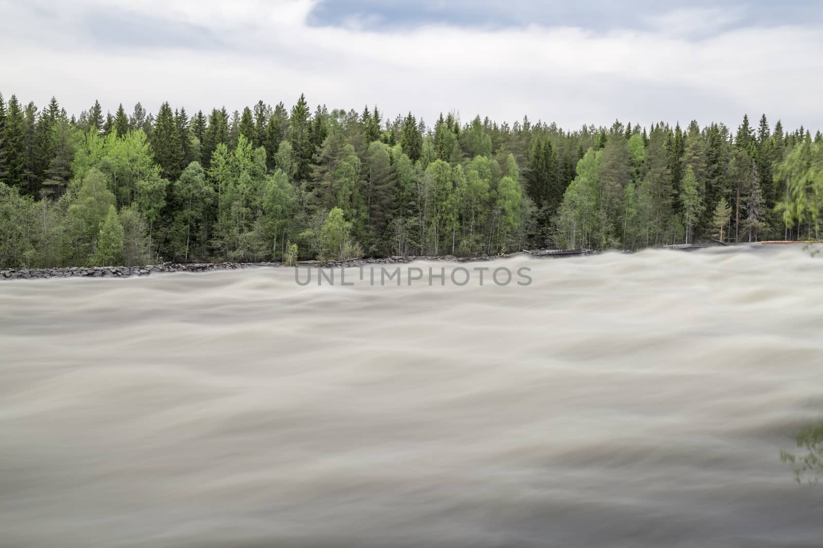 The rapids at Renforsen in Vindeln, Sweden with a wooden bridge.