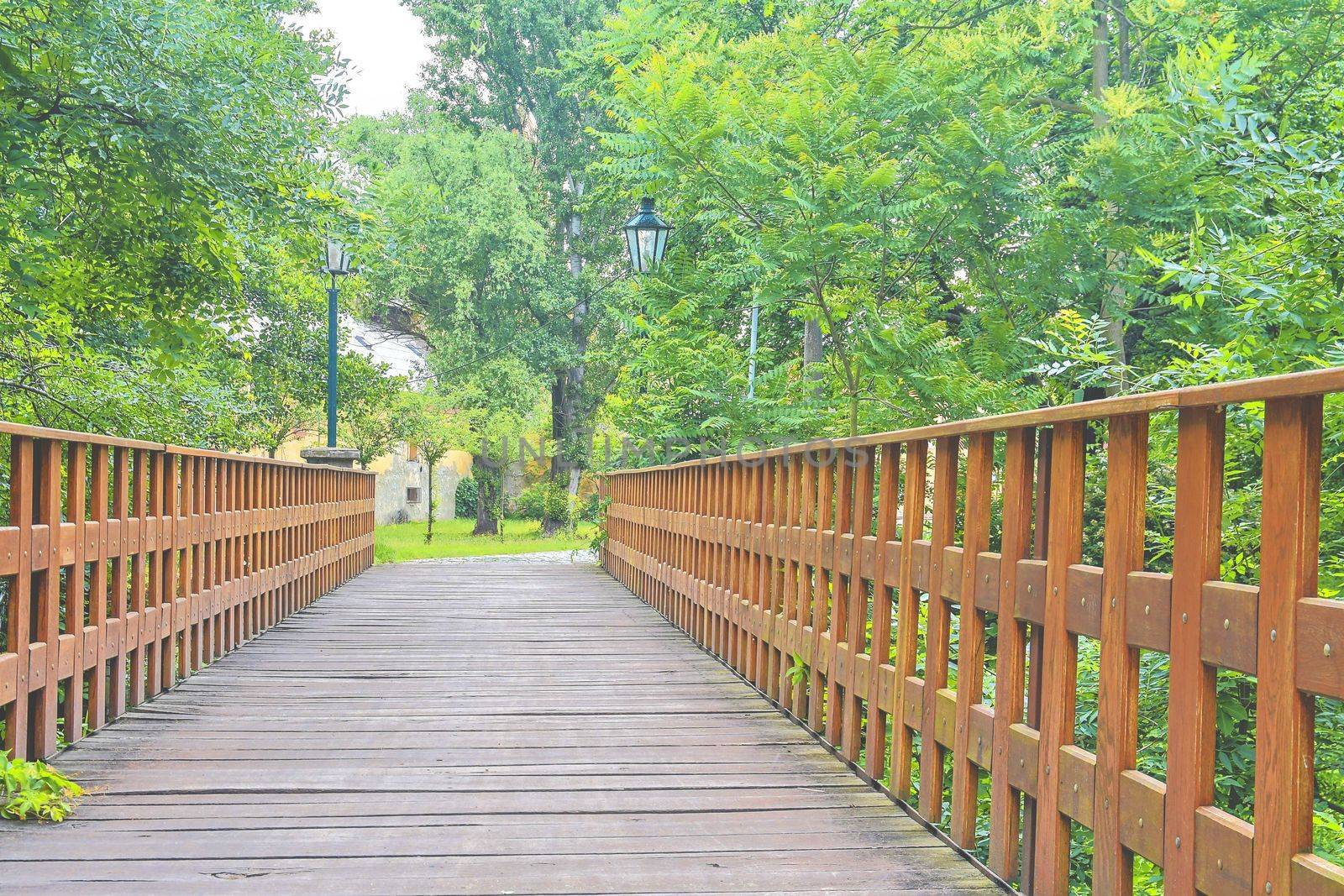 Old wooden bridge in town, natural vintage background by roman_nerud