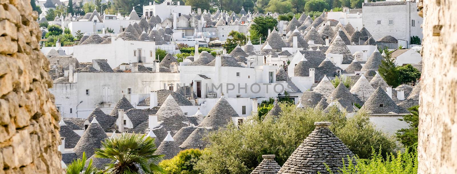 Scenic panoramic view of Alberobello town and its typical trulli buildings, Apulia, Italy