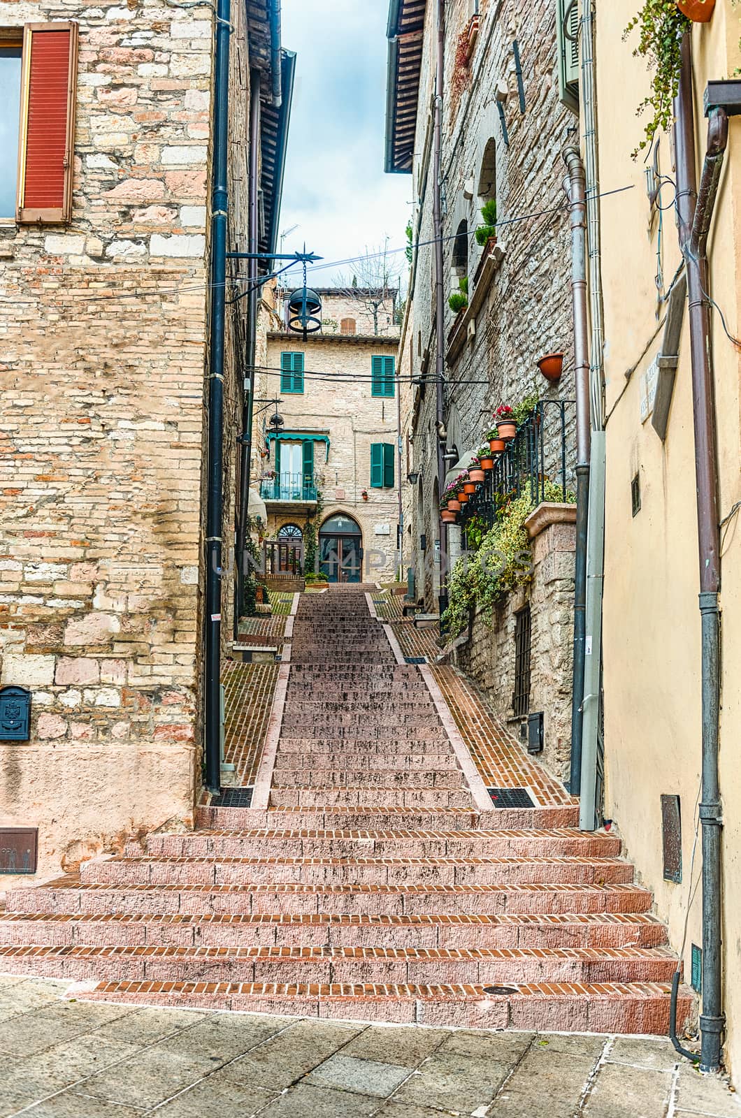 Scenic streets of the medieval town of Assisi, Umbria, Italy by marcorubino
