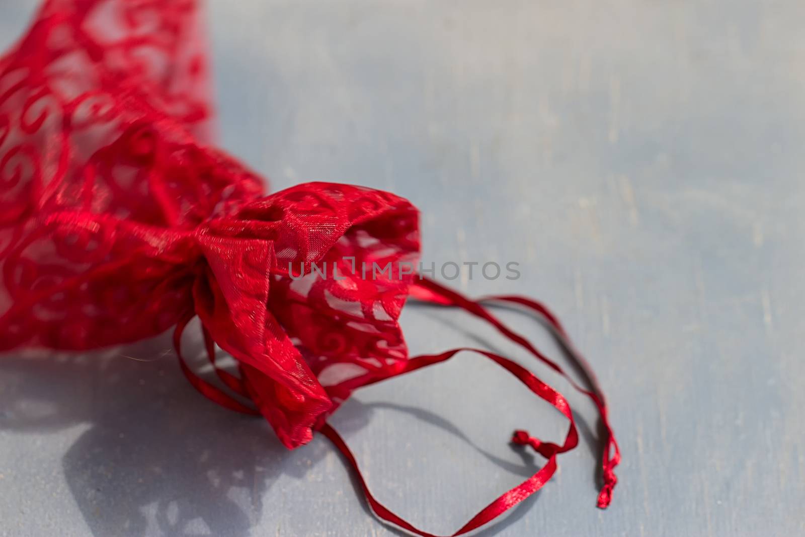 Red drawstring bag On a gray-blue background