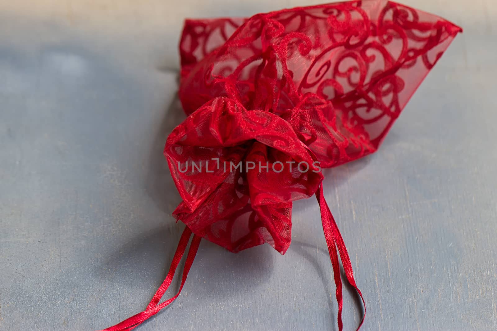 Red drawstring bag On a gray-blue background