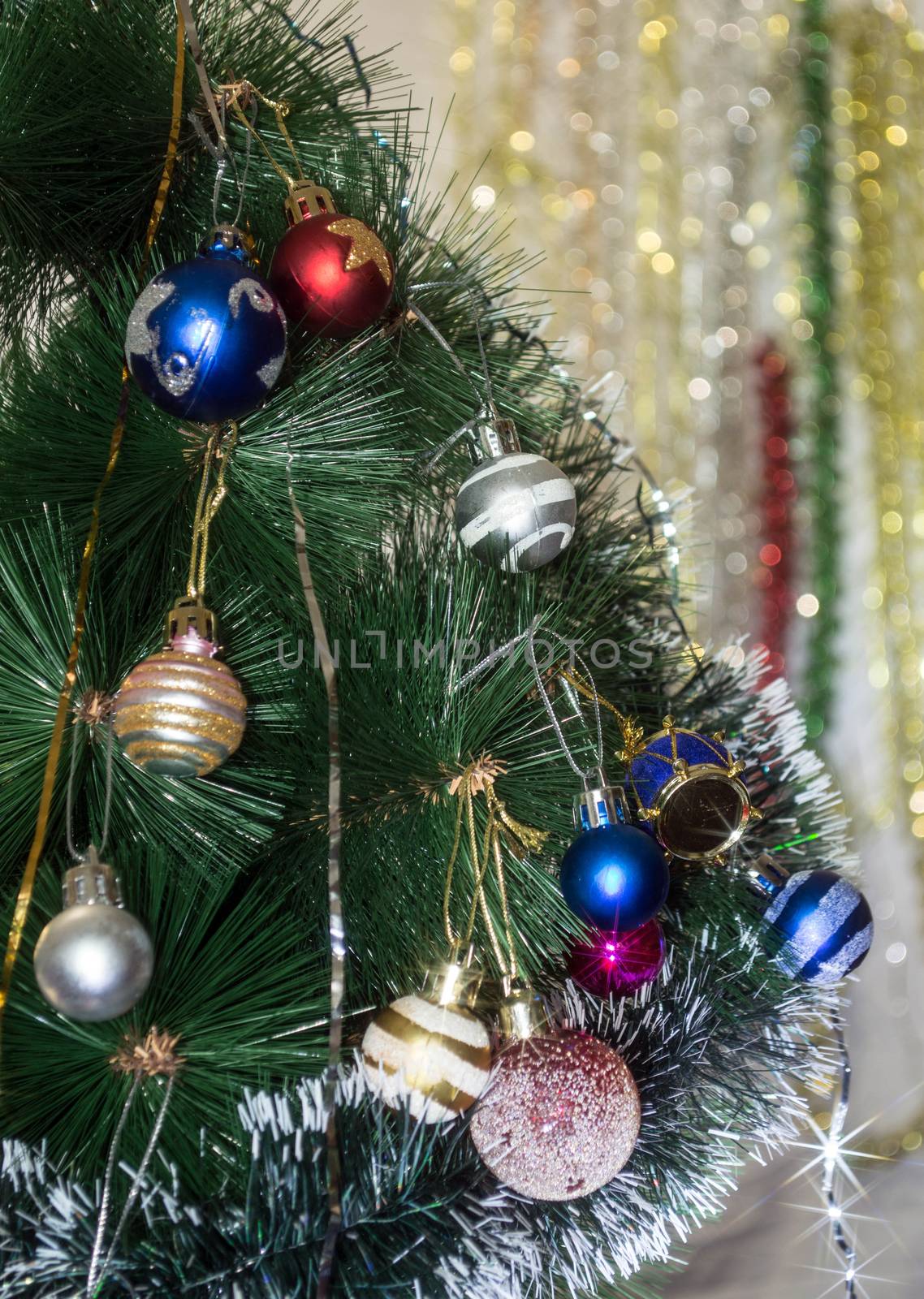 Christmas tree dressed differently colored toys
