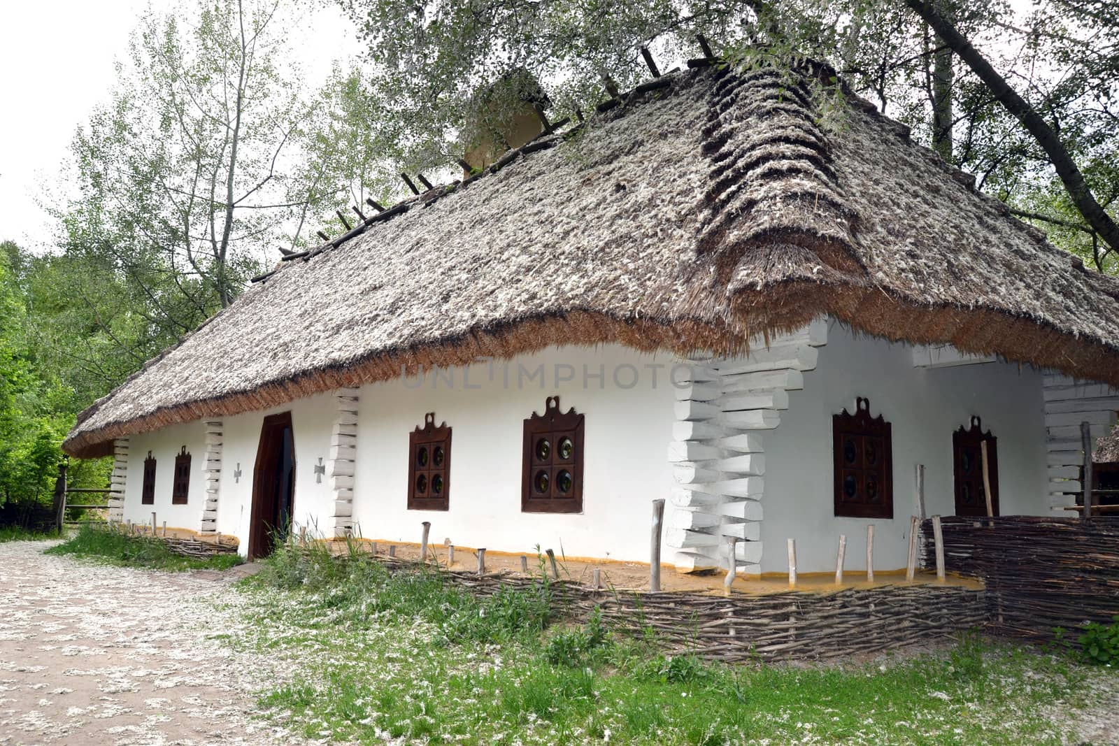 Ukrainian farmhouse with a woven fence