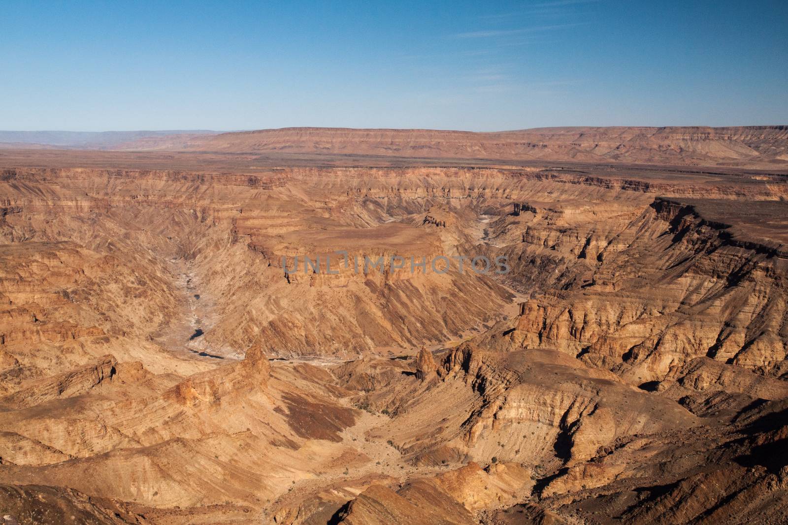 Horseshoe bend in Fish River Canyon on hot sunny day, Namibia by pyty