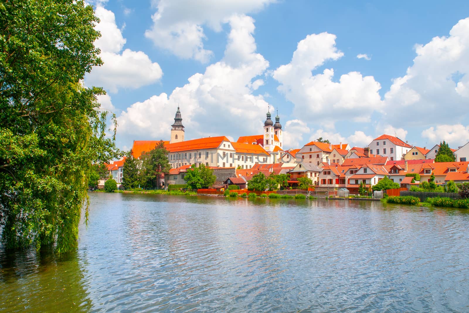 Panoramic view of Telc with reflection in Stepnicky pond, Czech Republic. UNESCO World Heritage Site.