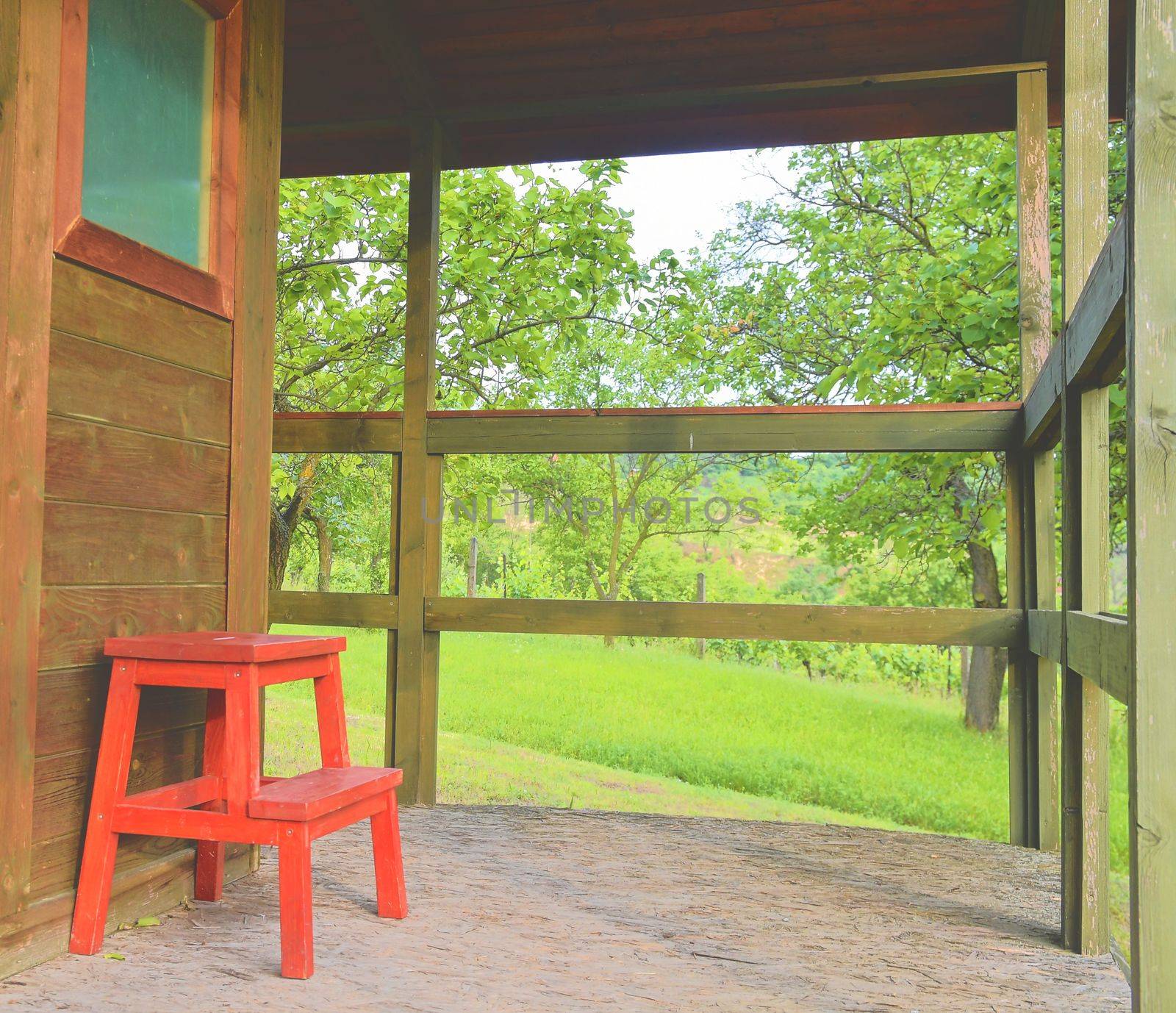 Wooden garden shed in a beautiful rural orchard. Close-up.