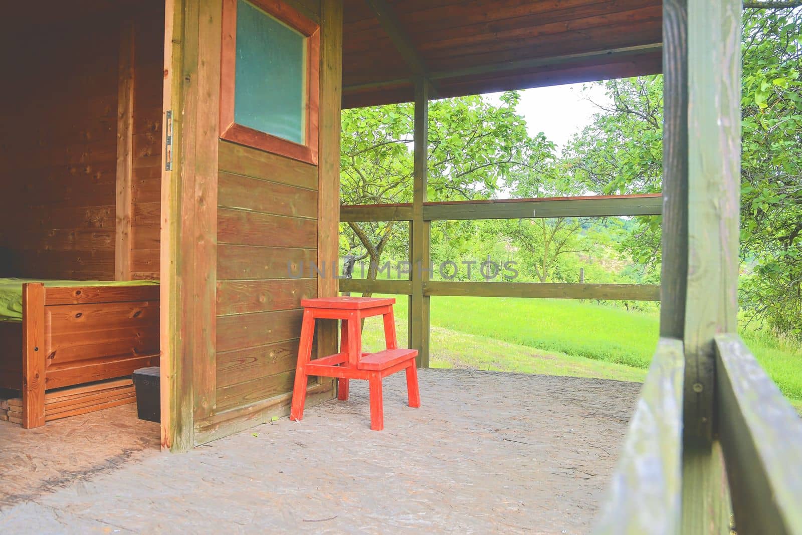 Small house cabin shed. Cute summer cabin in rural orchard.  Close-up by roman_nerud