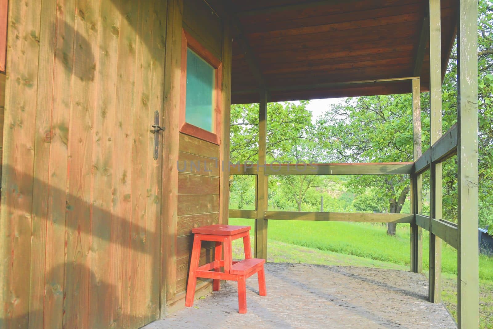 Small house cabin shed. Cute summer cabin in rural orchard.  Close-up by roman_nerud