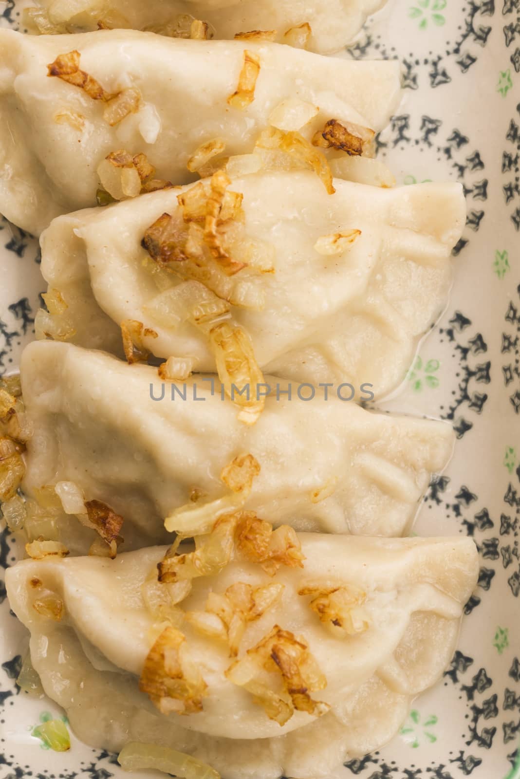 Polish pierogi filled with cabbage and mushrooms by joannawnuk