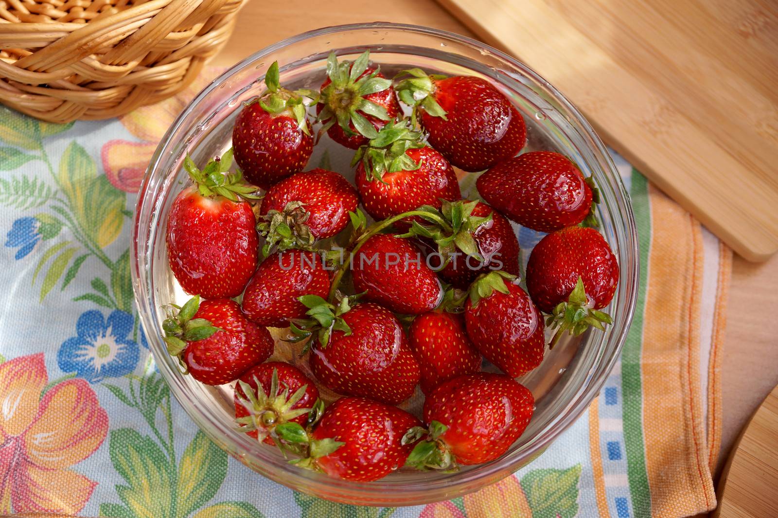 Fresh crop of strawberry from the Russian giving in capacity with water                               
