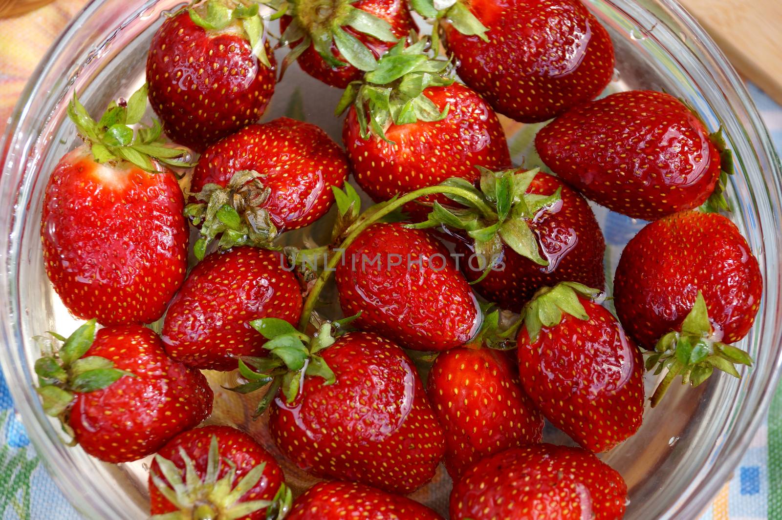 Fresh strawberry in capacity with water by Vadimdem