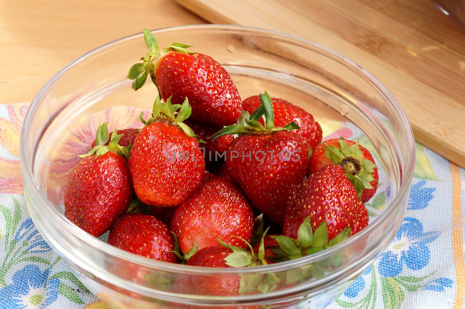 Fresh strawberry in a transparent salad bowl by Vadimdem