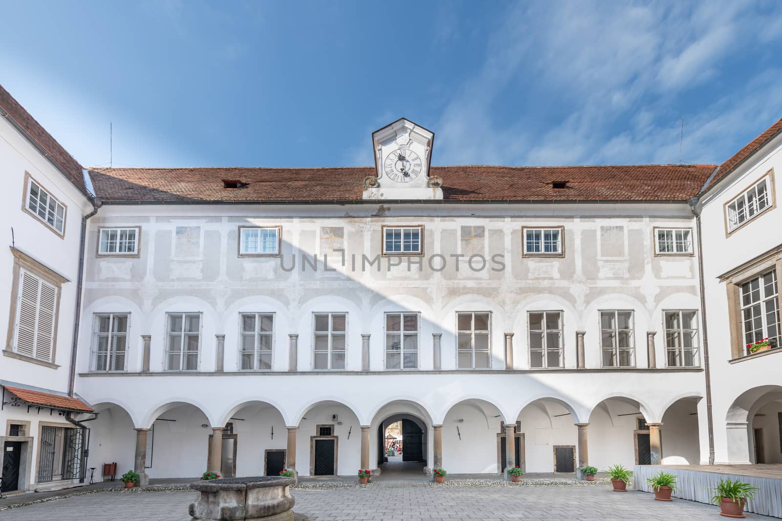 Courtyard of castle in Slovenska Bistrica with front entrance, the courtyard is used today as a grocery market, publicly owned, no release required