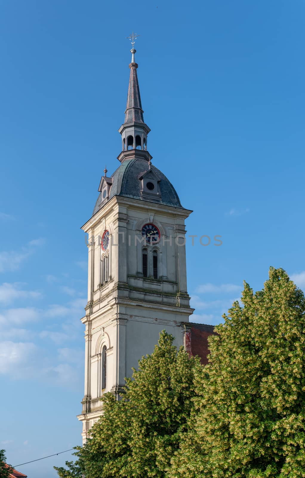 Church tower with clock by asafaric