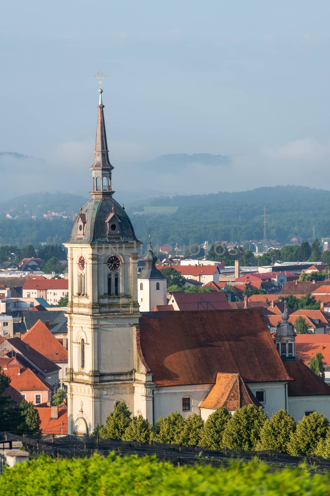 Church tower with clock, St. Bartholomew's church in Slovenska Bistrica, Slovenia