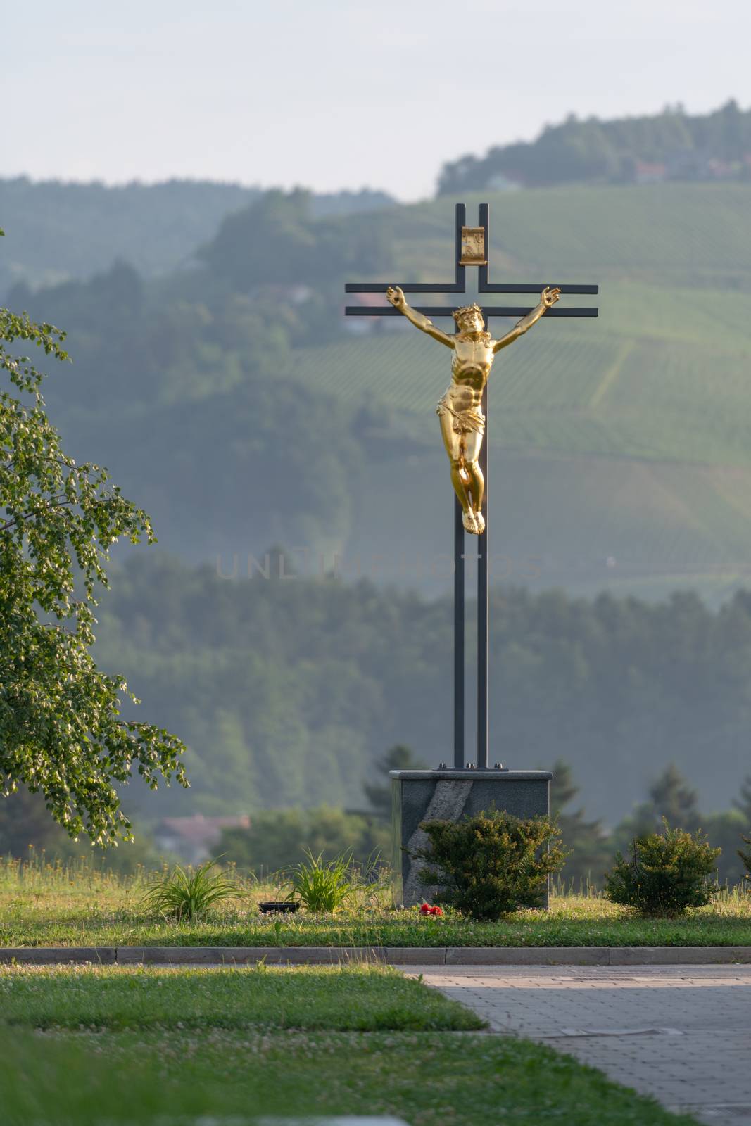 Jesus Christ on cross, golden statue by asafaric