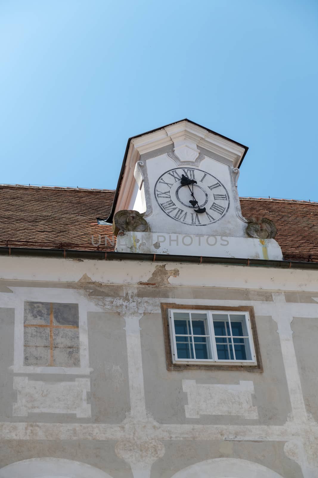 Castle tower with clock, detail of castle Slovenska Bistrica, Slovenia. Castle is publicly owned and no admission required