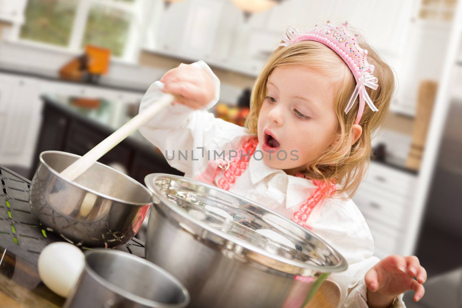 Cute Baby Girl Playing Cook With Pots and Pans In Kitchen by Feverpitched