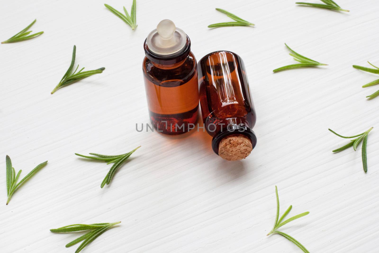 Rosemary essential oil on white