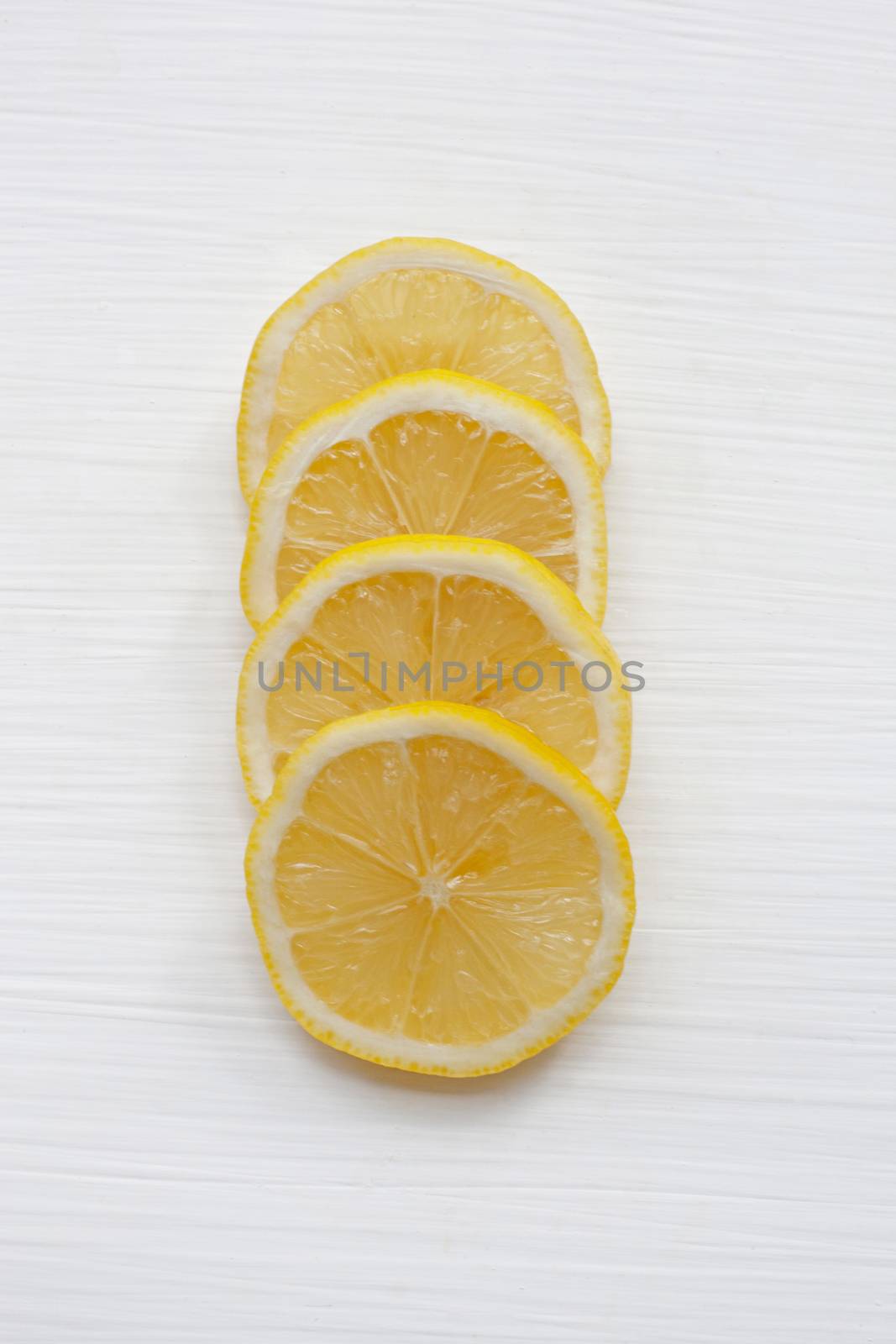 Fresh lemon slices  on a white background.