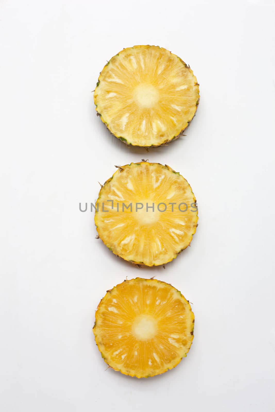 Slices of pineapple  isolated on white background.
