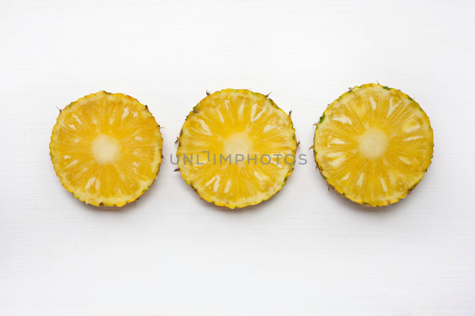Slices of pineapple  isolated on white background.
