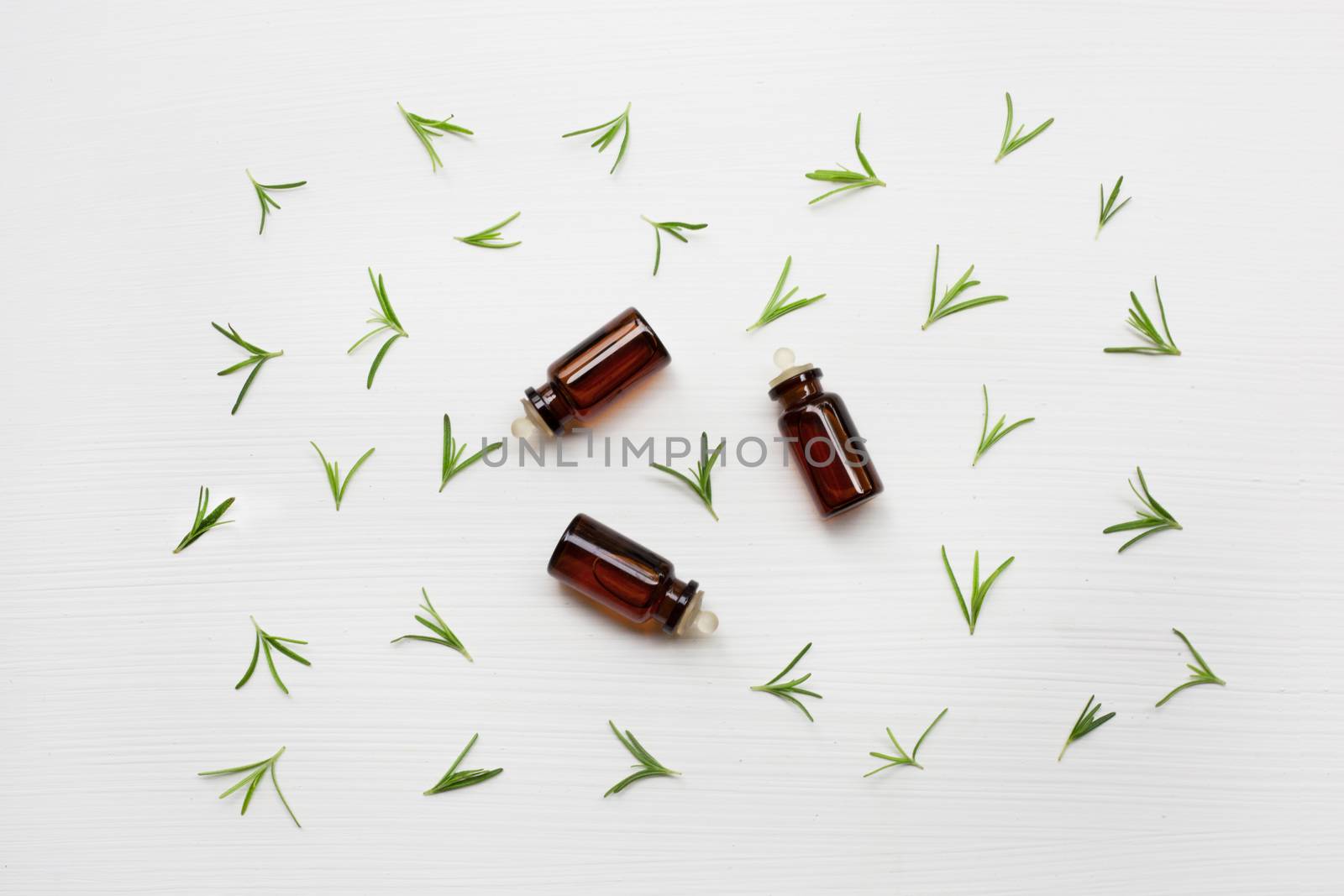 Rosemary essential oil on white