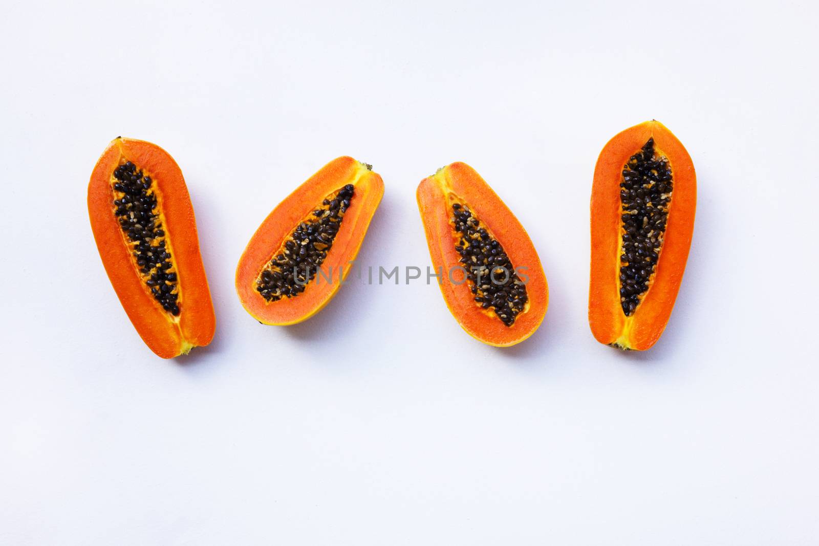 Papaya on white background. Copy space