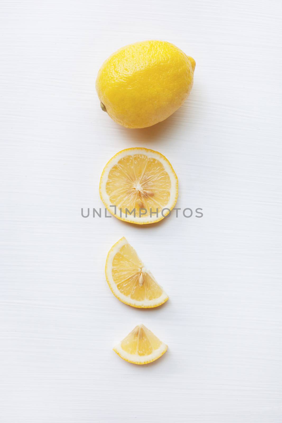 Fresh lemon with slice  on a white background.