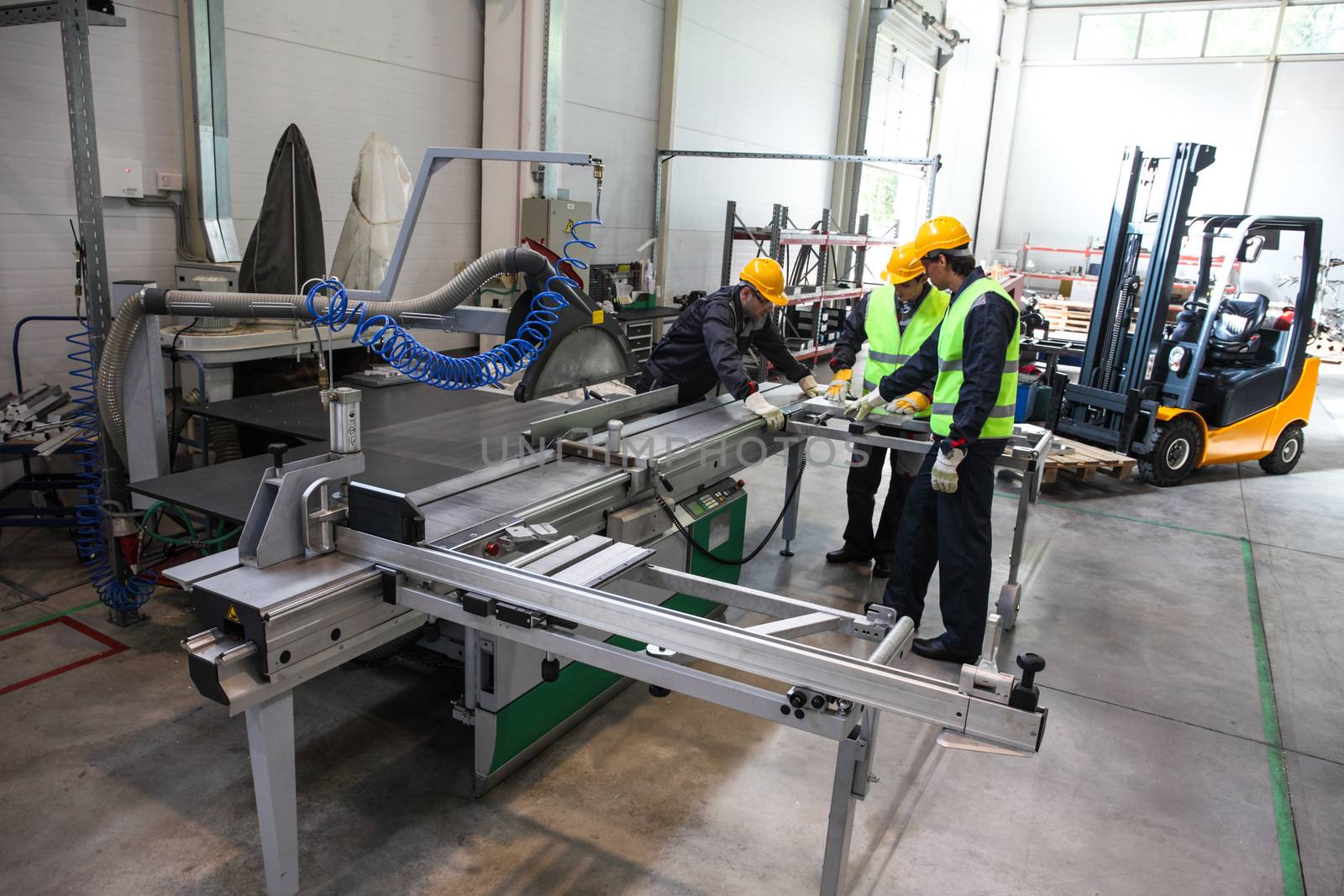 CNC machine shop with lathes, technicians and workers