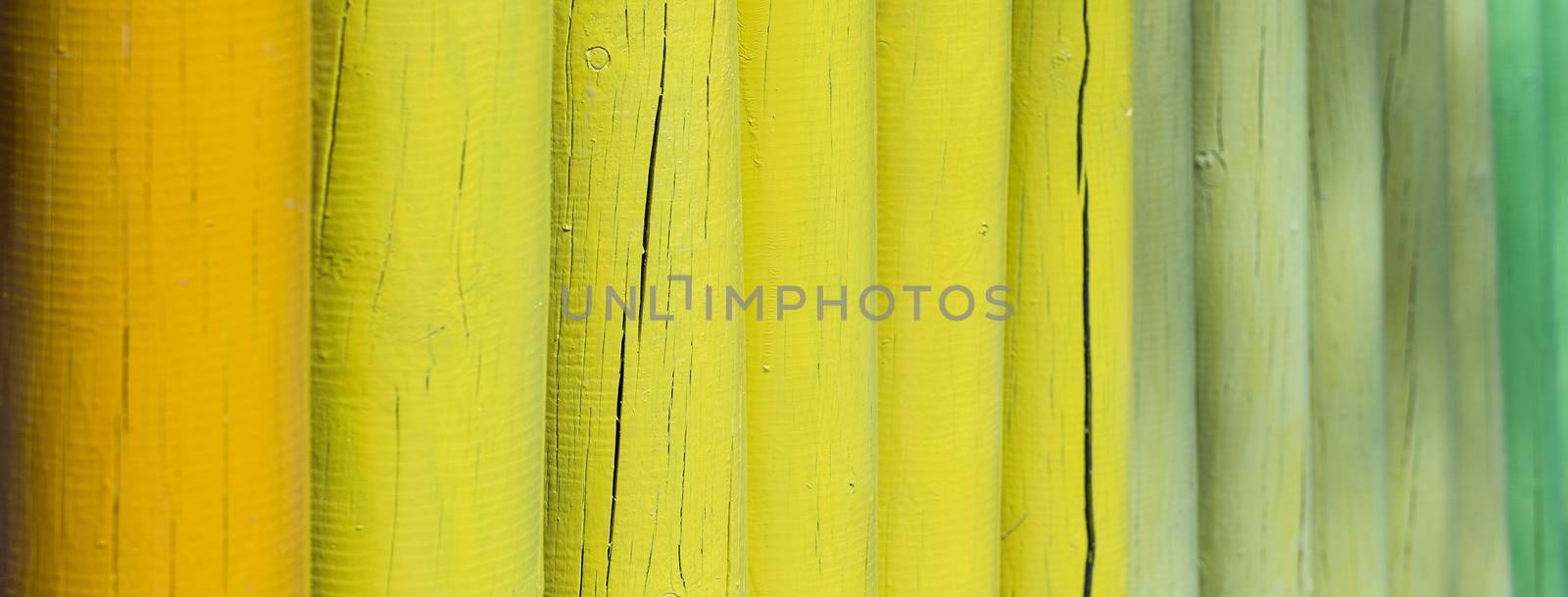 Closeup of a wooden fence, weathered and rough textured, suitable to be used as background. Selective focus