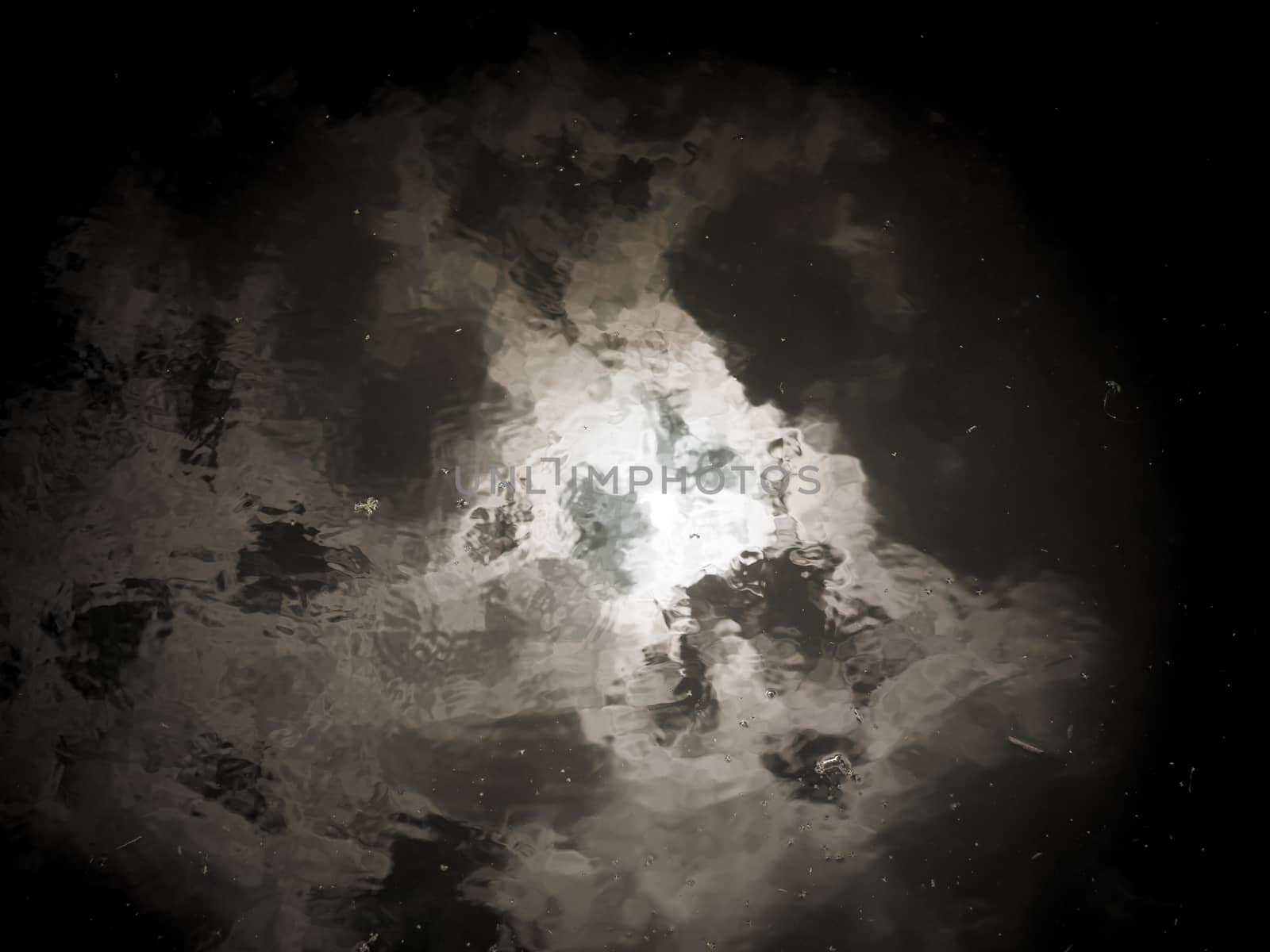 abstract and obscure water surface reflecting sky texture; Essex; England; UK