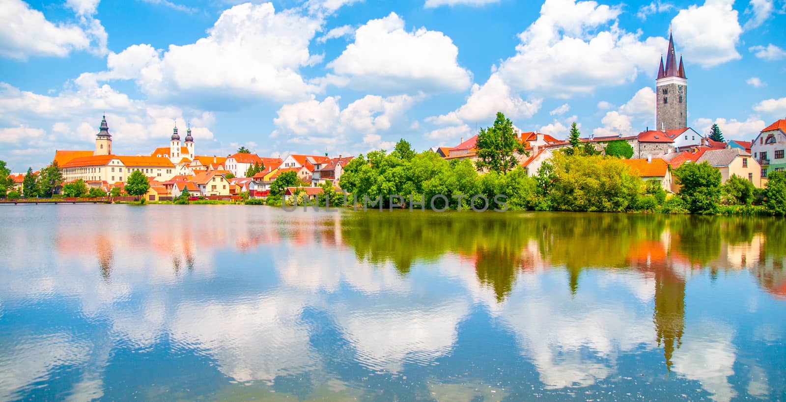 Panoramic view of Telc historical center. Water reflection, Czech Republic. UNESCO World Heritage Site. by pyty