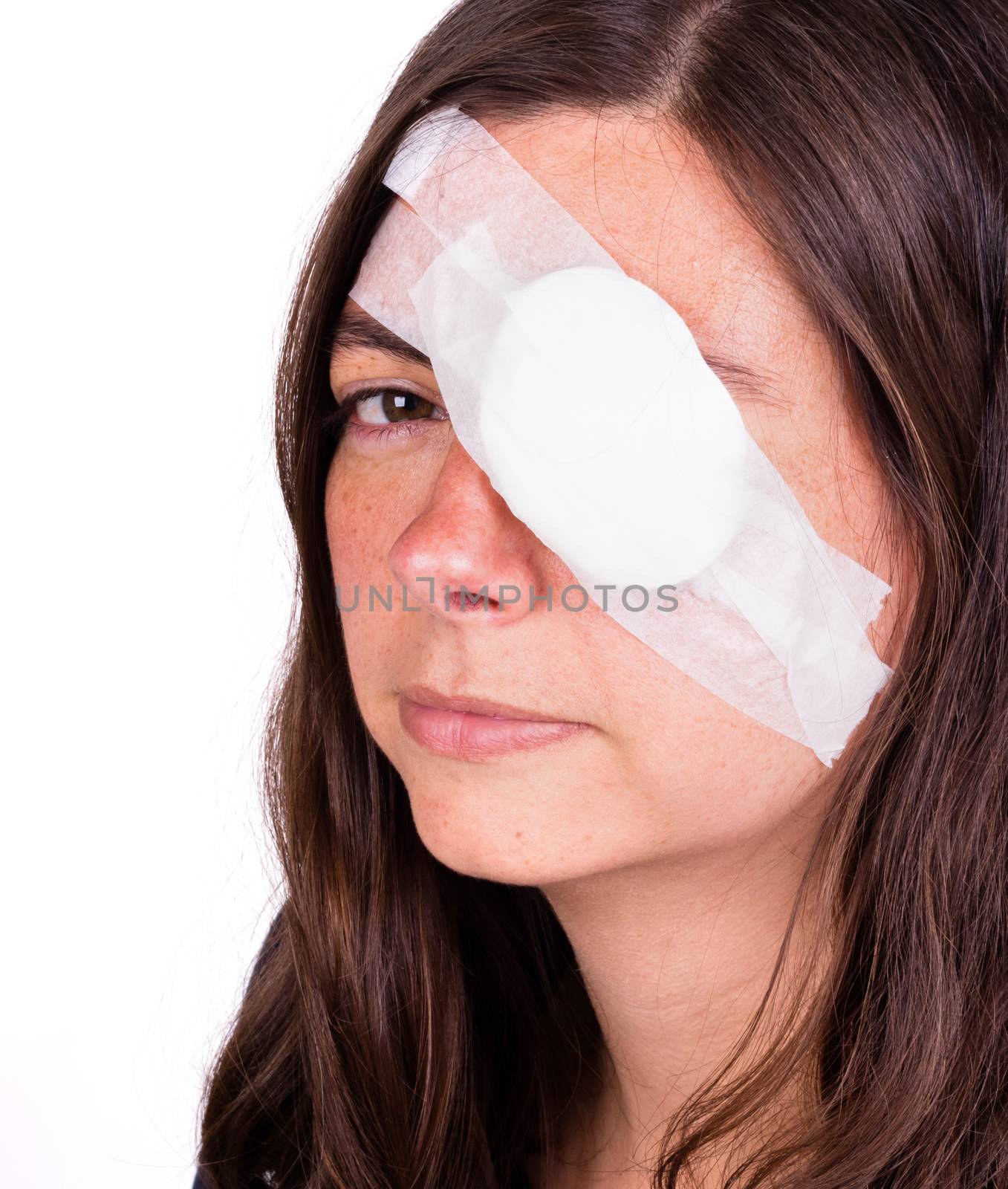 Portrait of woman wearing eye patch as protection after injury by michaklootwijk