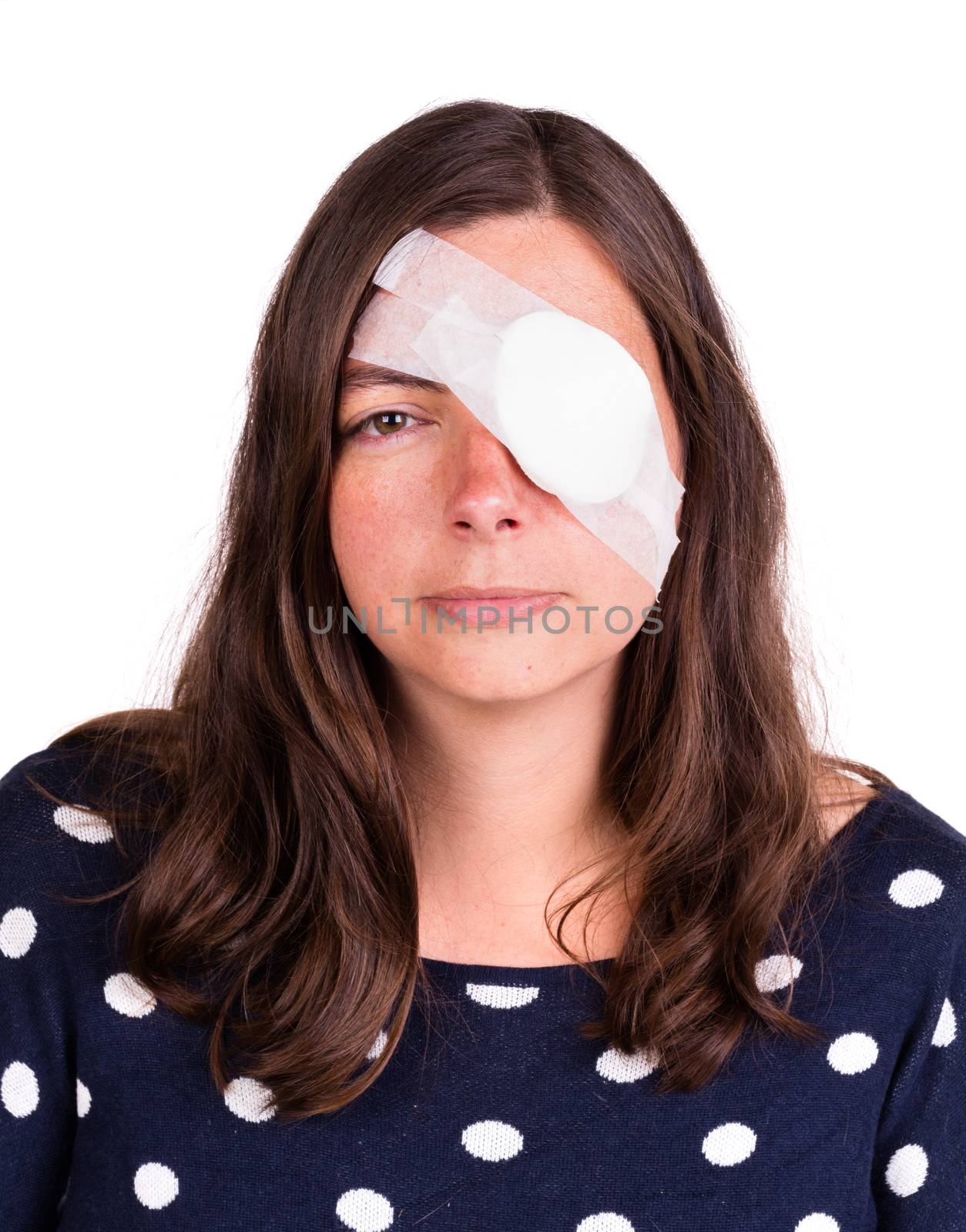 Portrait of woman wearing eye patch as protection after injury by michaklootwijk