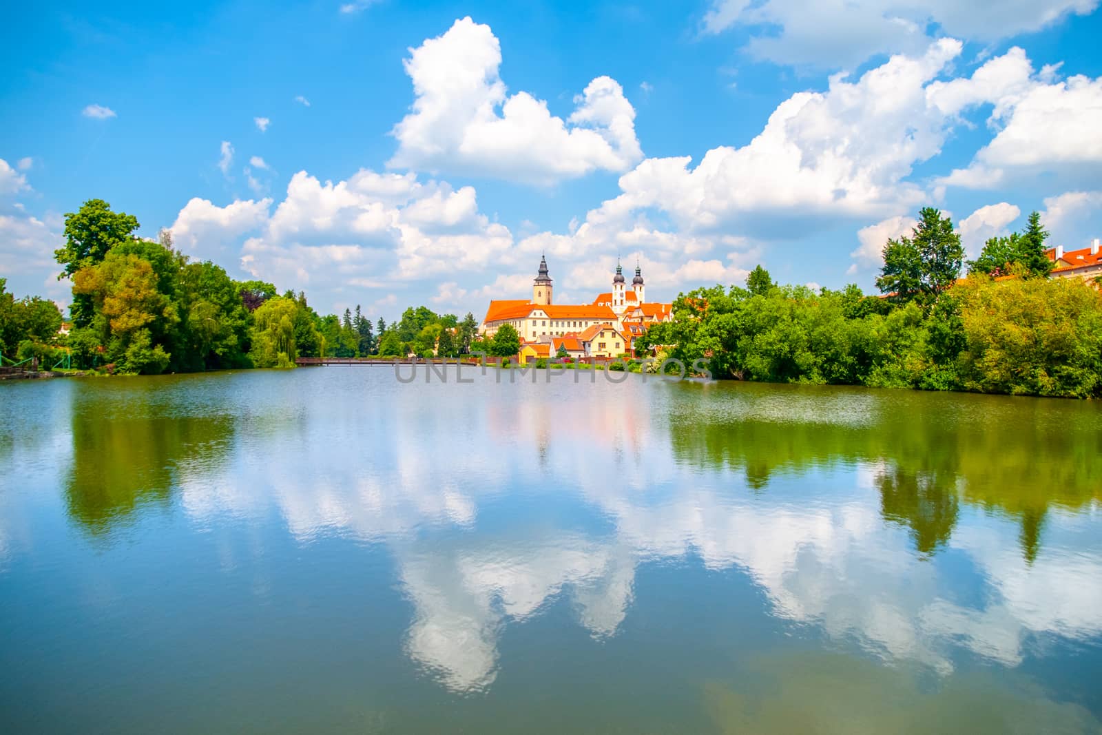 Panoramic view of Telc historical center. Water reflection, Czech Republic. UNESCO World Heritage Site. by pyty