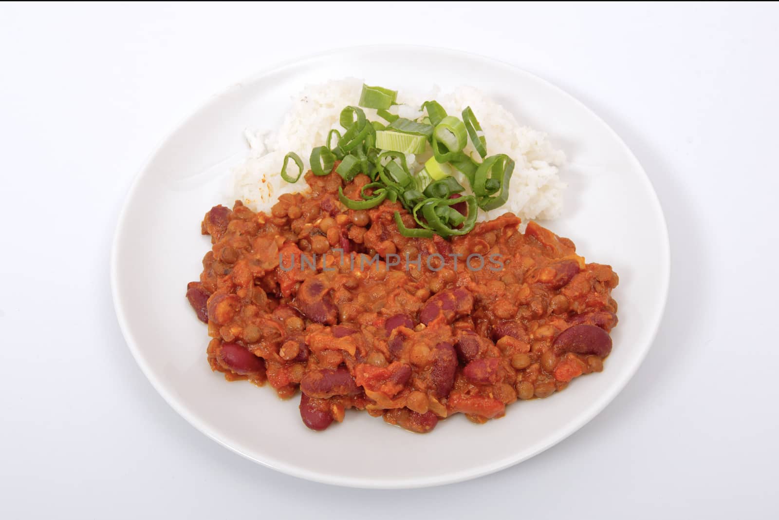 Indian legume hash with rice on a white background