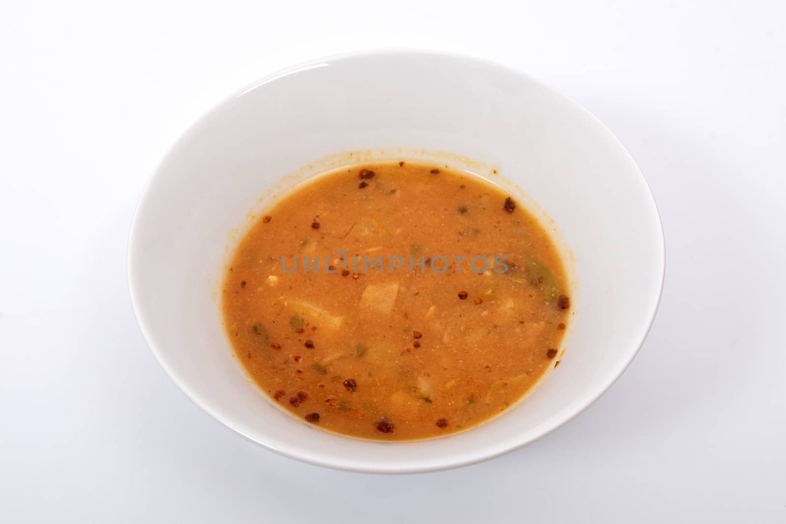 Oyster mushroom soup with vegetables on a white background