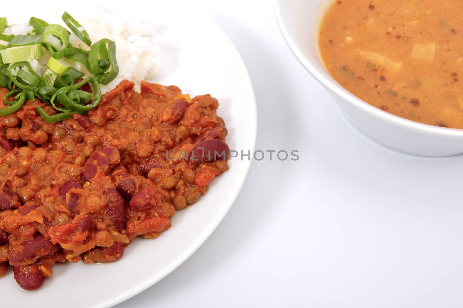 Indian legume hash with rice on a white background